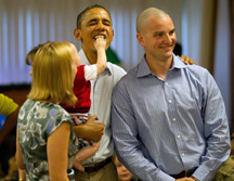 obama holding smiling baby