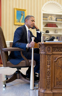 obama with bat in hand